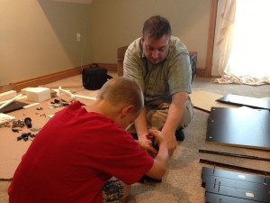 Helping Dad put some furniture together.